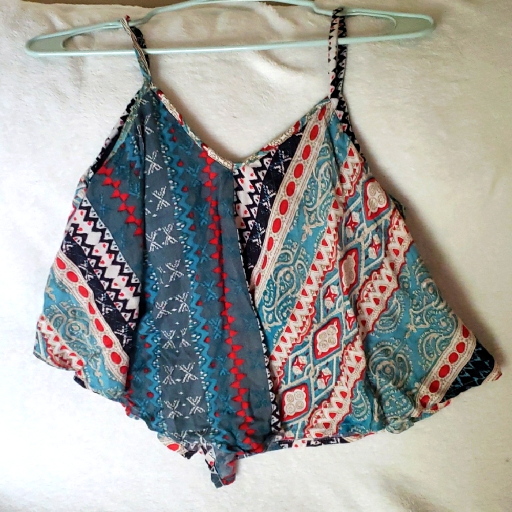 Multi color crop top with inside sewn bra. This is a size large, made by Angie.